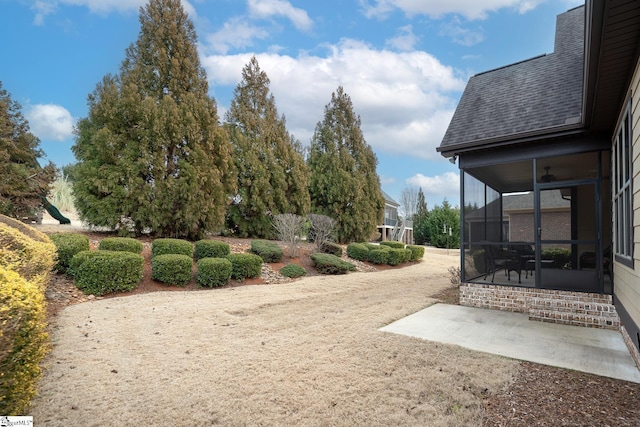 view of yard with a sunroom