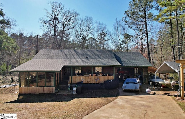 view of front of house featuring a sunroom