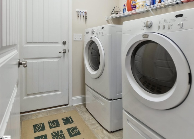 laundry area with washing machine and clothes dryer