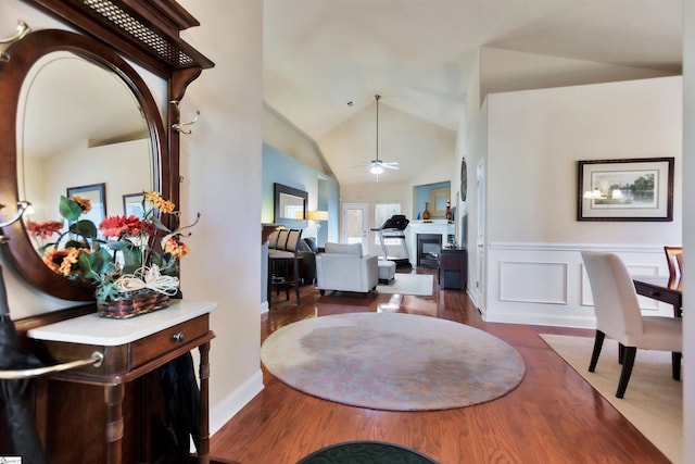 dining room featuring ceiling fan, dark hardwood / wood-style flooring, and high vaulted ceiling