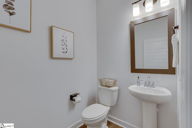 bathroom with toilet and sink