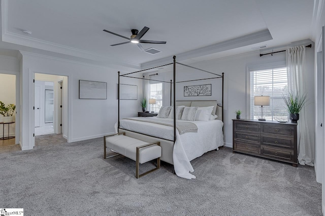 carpeted bedroom with multiple windows, crown molding, and ceiling fan