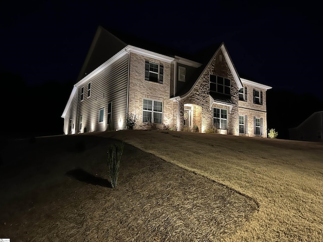 view of front of home with a lawn