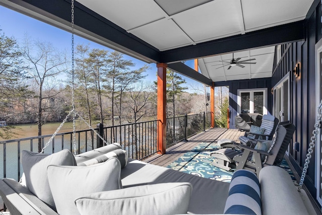 deck featuring ceiling fan and an outdoor living space