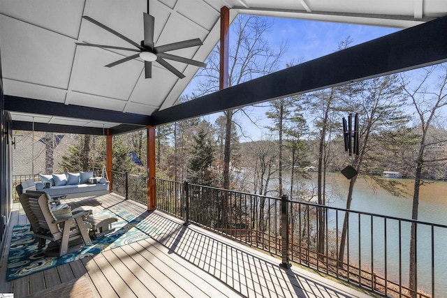 deck featuring an outdoor hangout area, ceiling fan, and a water view