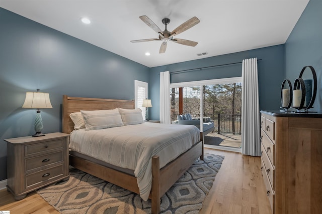 bedroom with ceiling fan, light hardwood / wood-style flooring, and access to outside