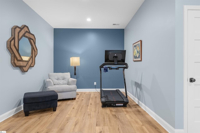 workout area featuring light hardwood / wood-style floors