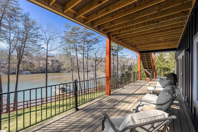 wooden deck with a water view