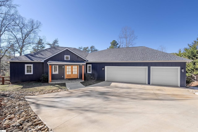 single story home with a garage and french doors