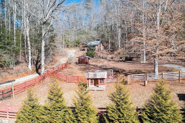 birds eye view of property featuring a rural view