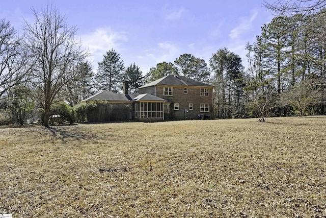 view of yard featuring a sunroom