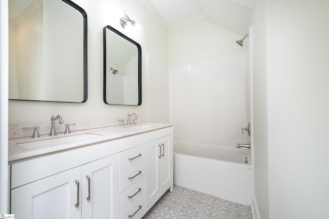 bathroom with tile patterned flooring, vanity, and shower / bathtub combination