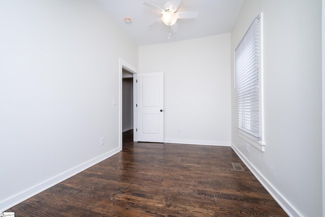 unfurnished bedroom with dark hardwood / wood-style floors and ceiling fan