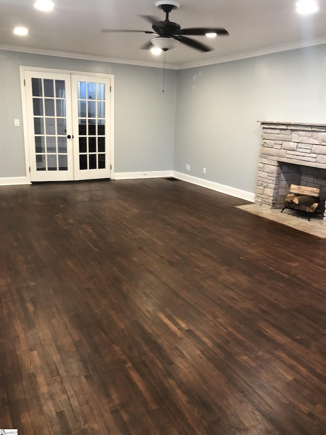 unfurnished living room featuring french doors, ornamental molding, and dark hardwood / wood-style floors