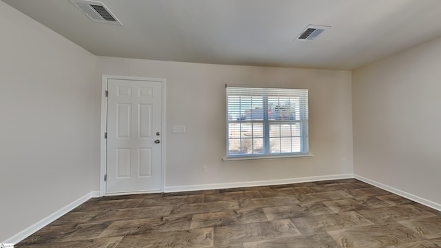 empty room with dark hardwood / wood-style floors