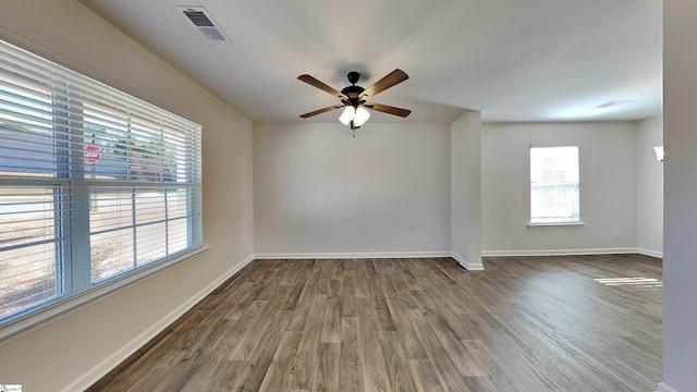 empty room featuring hardwood / wood-style flooring and ceiling fan