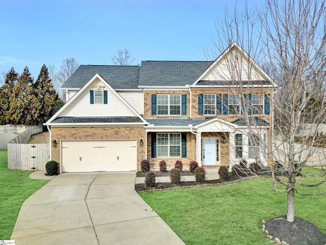 craftsman-style home featuring a garage and a front lawn