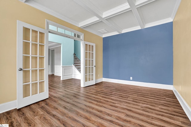 unfurnished room with ornamental molding, coffered ceiling, hardwood / wood-style floors, and french doors