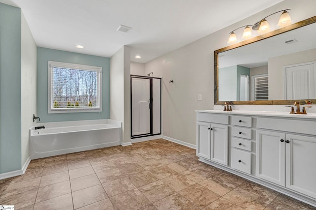 bathroom featuring vanity and shower with separate bathtub