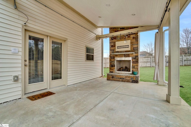 view of patio / terrace with an outdoor stone fireplace