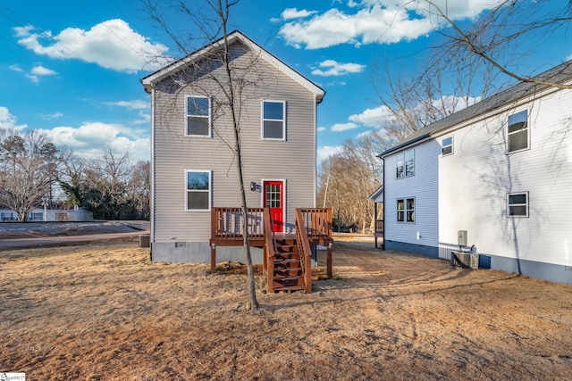 rear view of house featuring a yard and cooling unit