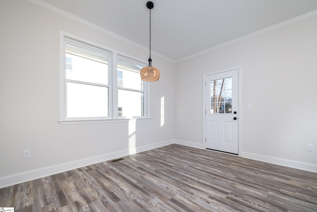 interior space with dark wood-type flooring and ornamental molding