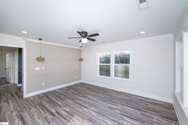 spare room with ceiling fan, ornamental molding, and dark hardwood / wood-style floors