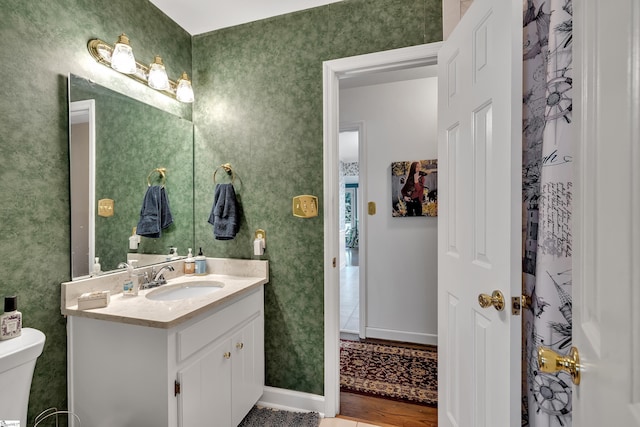 bathroom with vanity and toilet