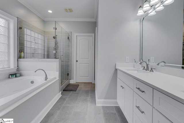 bathroom with vanity, crown molding, a healthy amount of sunlight, and separate shower and tub