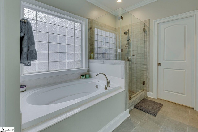 bathroom with crown molding, independent shower and bath, and a wealth of natural light