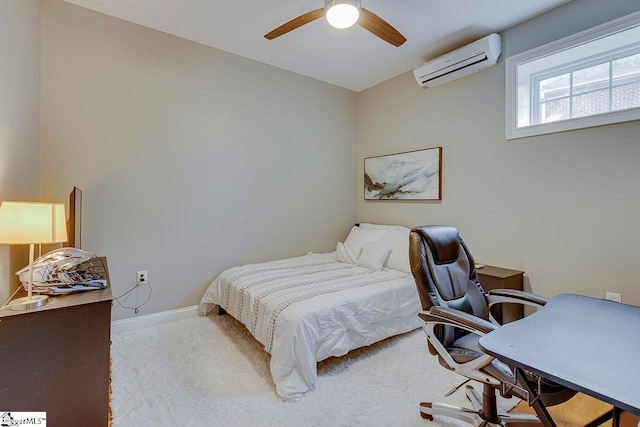 bedroom with light carpet, ceiling fan, and a wall mounted AC