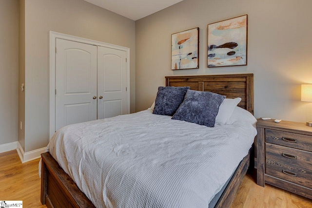 bedroom featuring a closet and light hardwood / wood-style flooring