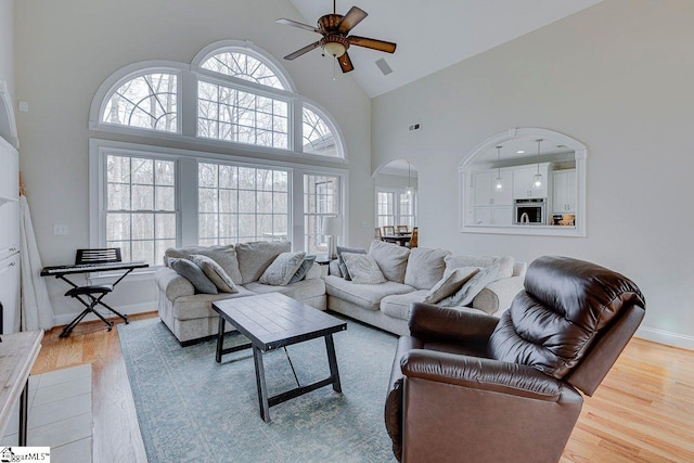 living room featuring plenty of natural light and light hardwood / wood-style floors