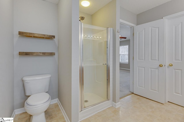 bathroom with toilet and walk in shower