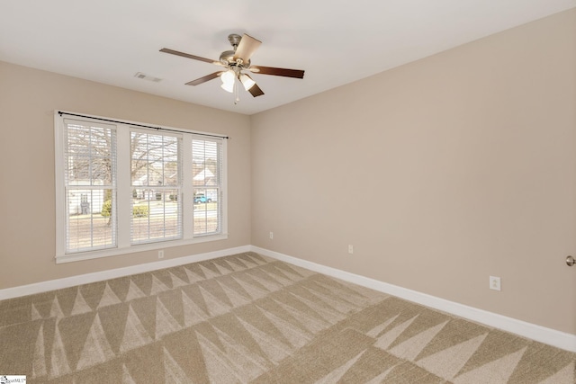 carpeted empty room with ceiling fan