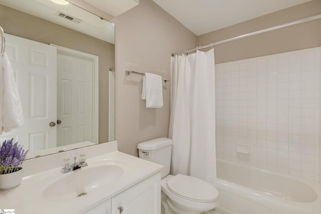 full bathroom featuring shower / bath combination with curtain, vanity, and toilet