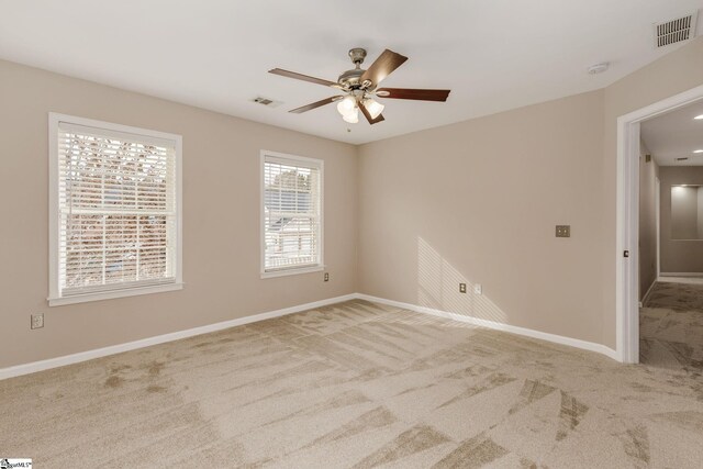 carpeted empty room with ceiling fan