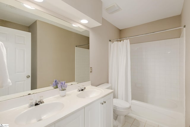 full bathroom featuring tile patterned floors, toilet, shower / tub combo, and vanity