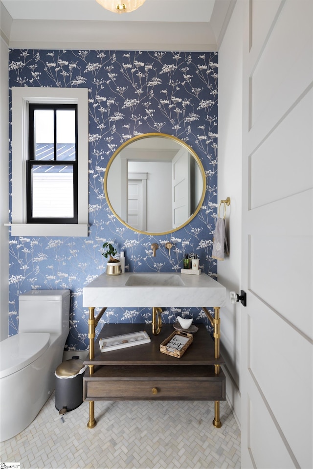 bathroom with toilet and tile patterned flooring