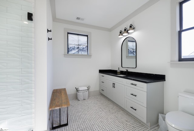 bathroom with vanity and toilet