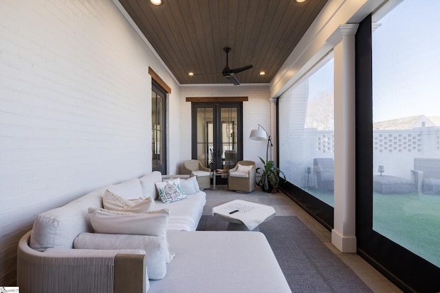 sunroom / solarium with wooden ceiling, ceiling fan, and french doors