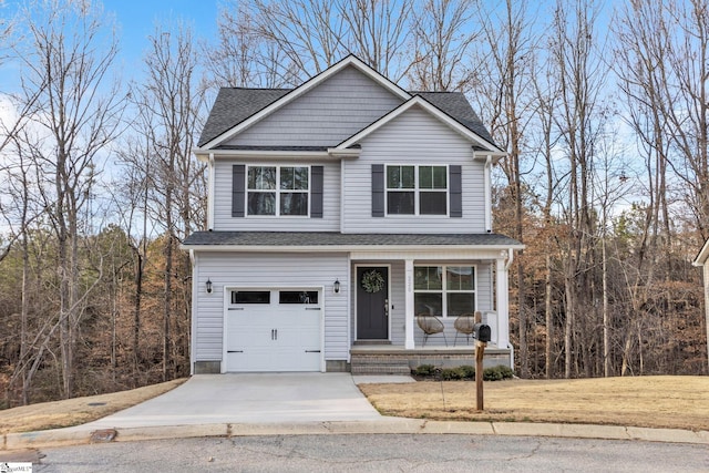 view of front property featuring a garage and covered porch