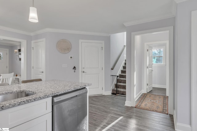 kitchen with pendant lighting, white cabinetry, dark hardwood / wood-style flooring, stainless steel dishwasher, and light stone counters