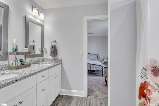 bathroom with vanity and hardwood / wood-style floors