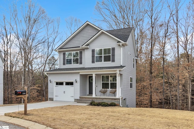 view of front of home with a garage, covered porch, and a front lawn