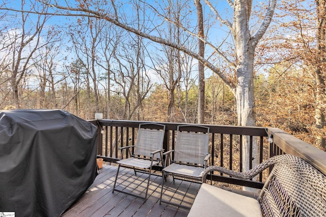 wooden deck with grilling area