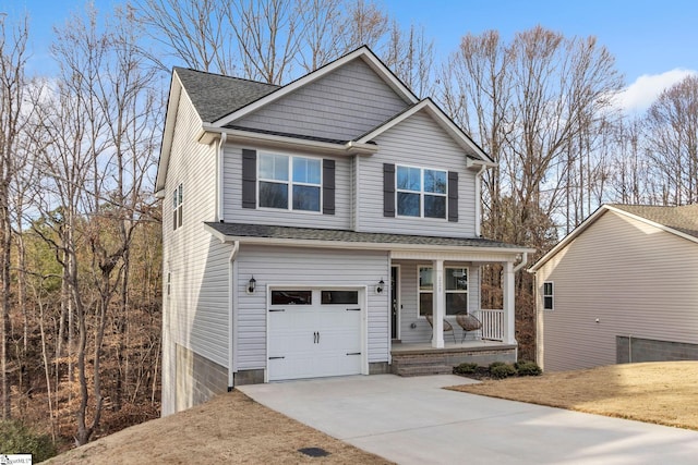 view of front of house featuring a porch and a garage