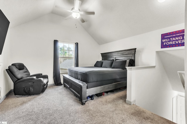 carpeted bedroom with ceiling fan and vaulted ceiling