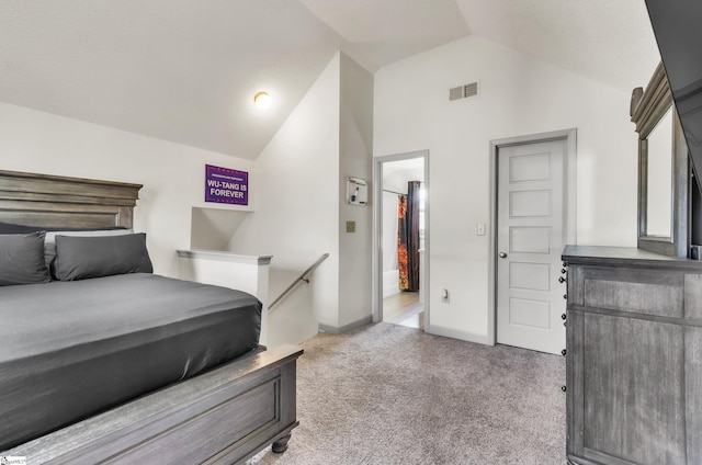 carpeted bedroom featuring lofted ceiling