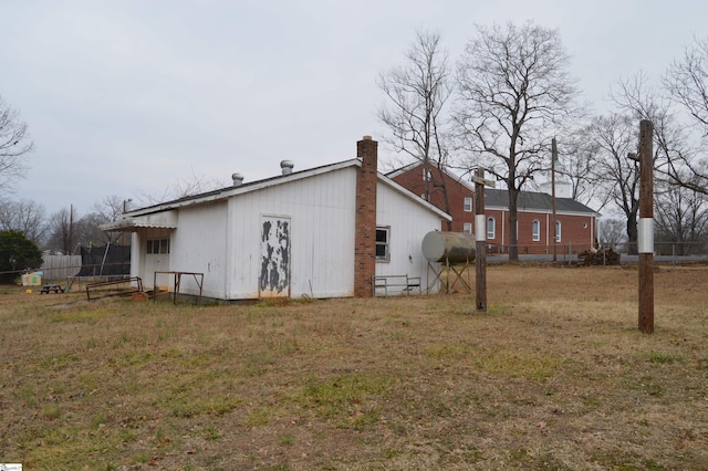 view of side of property featuring a yard